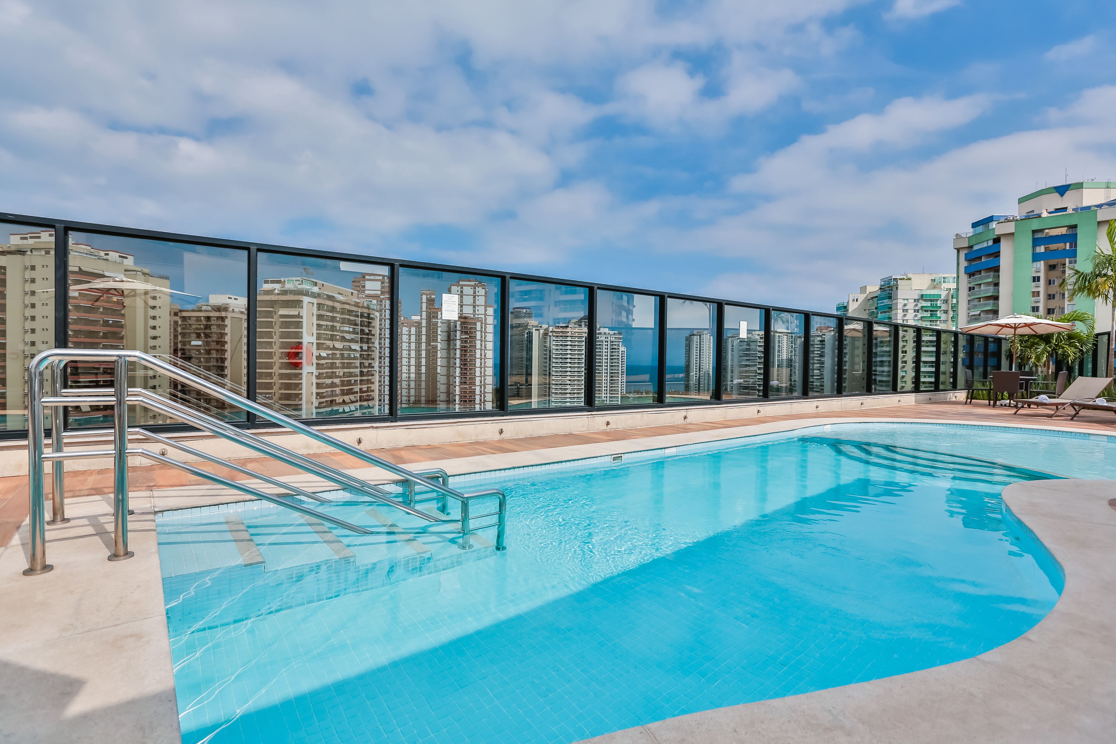 outdoor pool, open 9:00 am to 5:00 pm, pool umbrellas, pool loungers