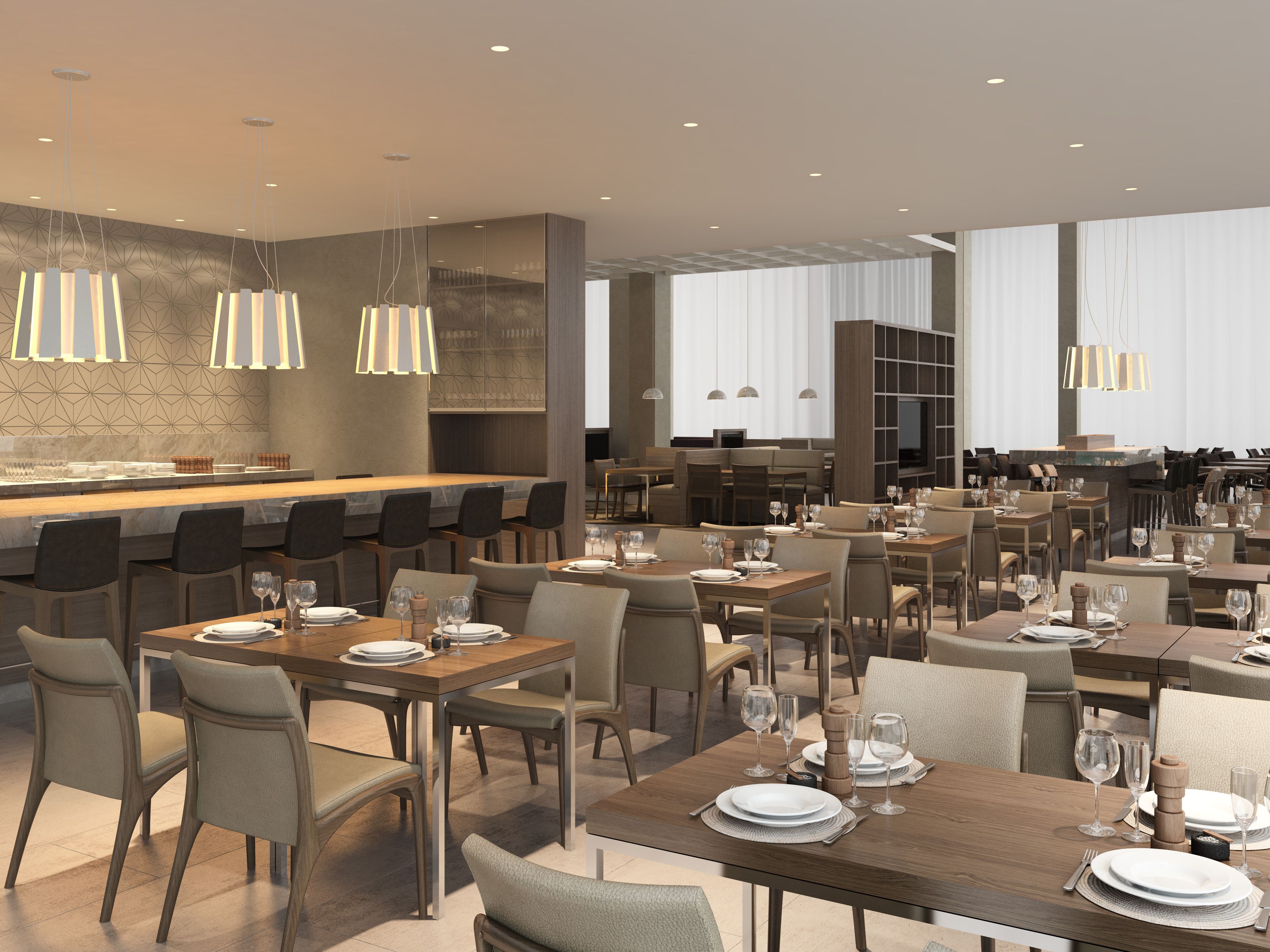 A modern restaurant with multiple dining tables and chairs, overhead lighting, and a bar area.