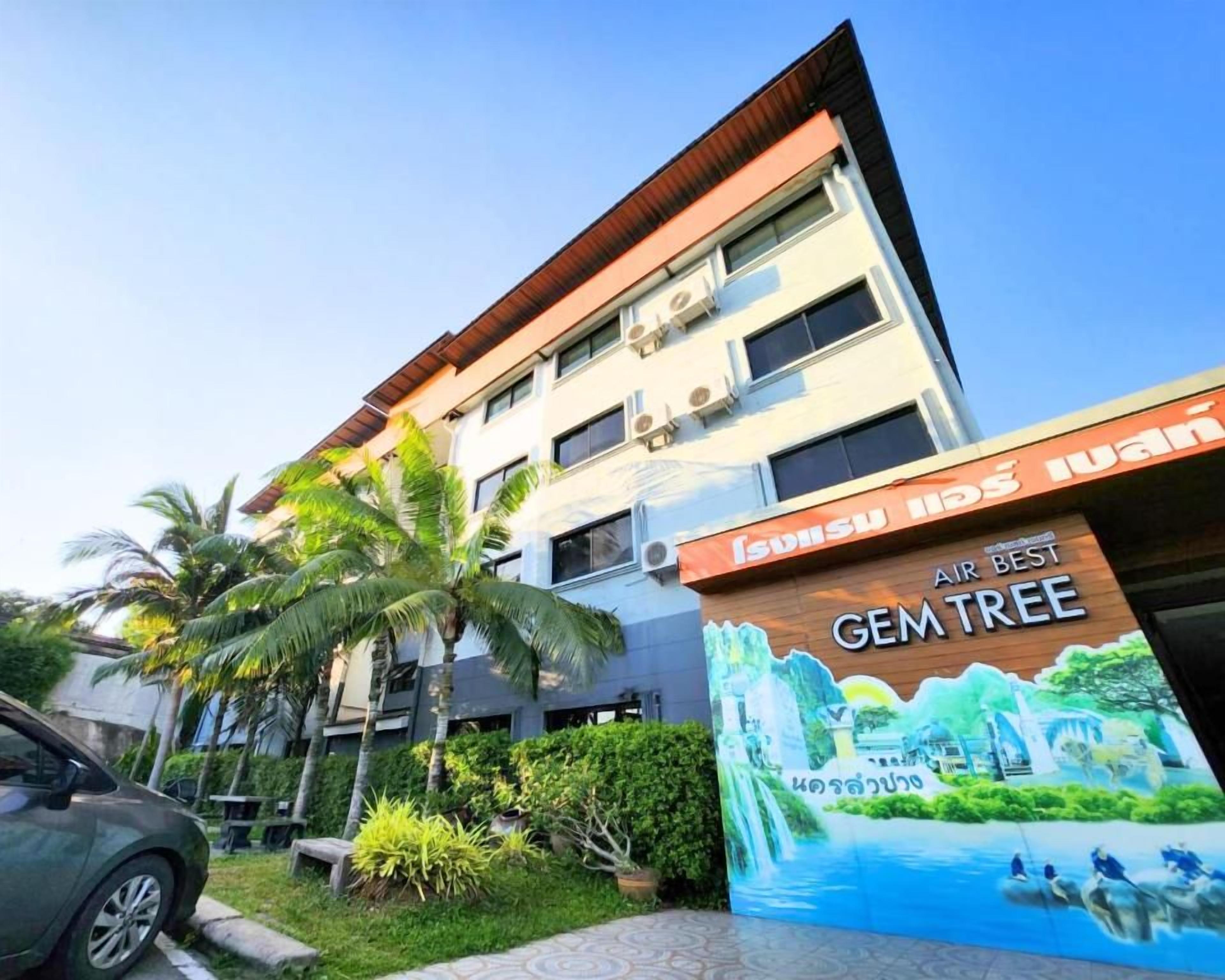 A multi-story building with a sign that reads 'AIR BEST GEMTREE'.
