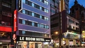 A hotel with a modern facade, multiple floors, and a prominent sign for "LE ROOM HOTEL". - Le Room Hotel Taoyuan (Taoyuan City)