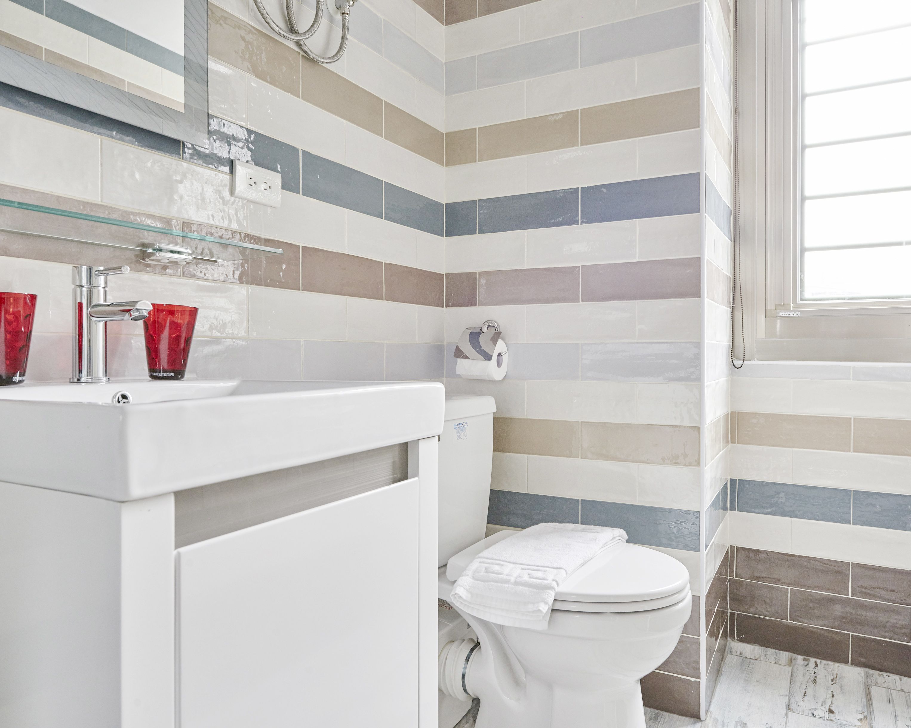 shower, hair dryer, slippers, towels