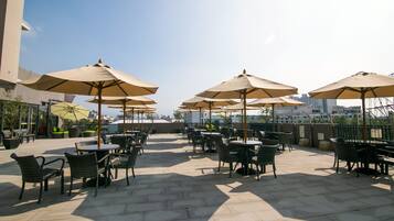 Seasonal outdoor pool, pool umbrellas, pool loungers