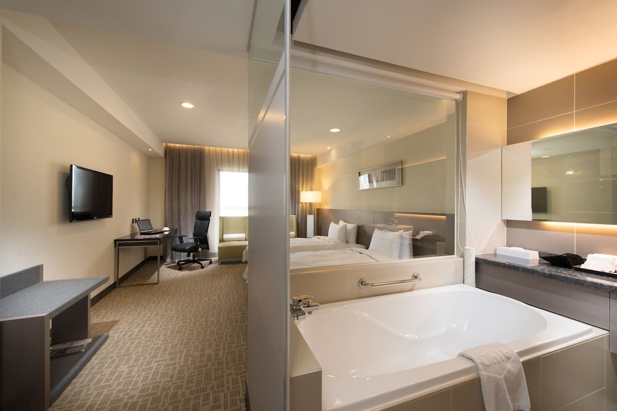 deluxe twin room | bathroom | hair dryer, slippers, towels