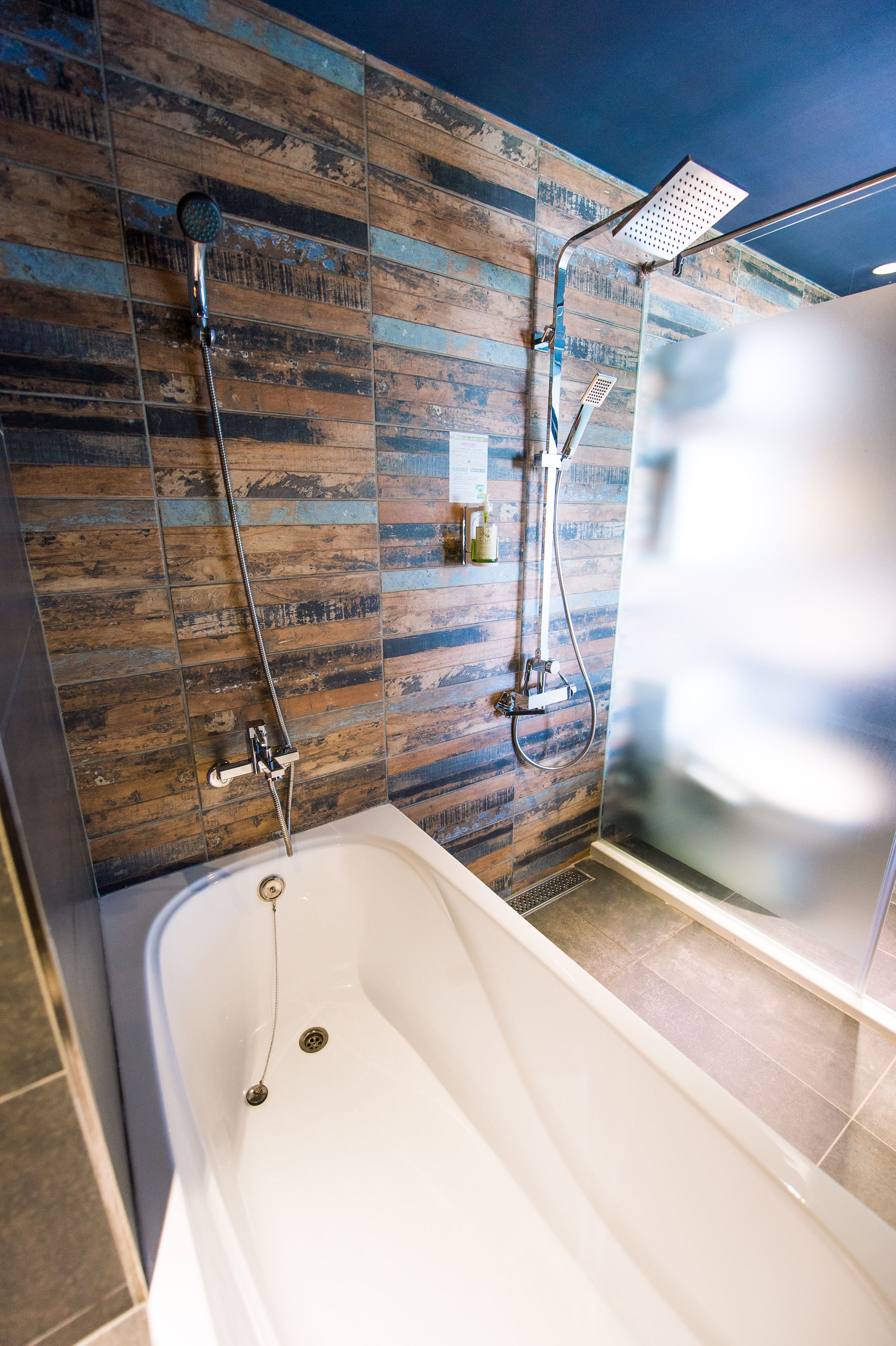 standard quadruple room, 2 queen beds | bathroom | separate bathtub and shower, free toiletries, hair dryer, slippers