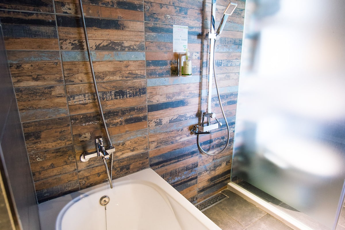 standard quadruple room, 2 queen beds | bathroom | separate bathtub and shower, free toiletries, hair dryer, slippers