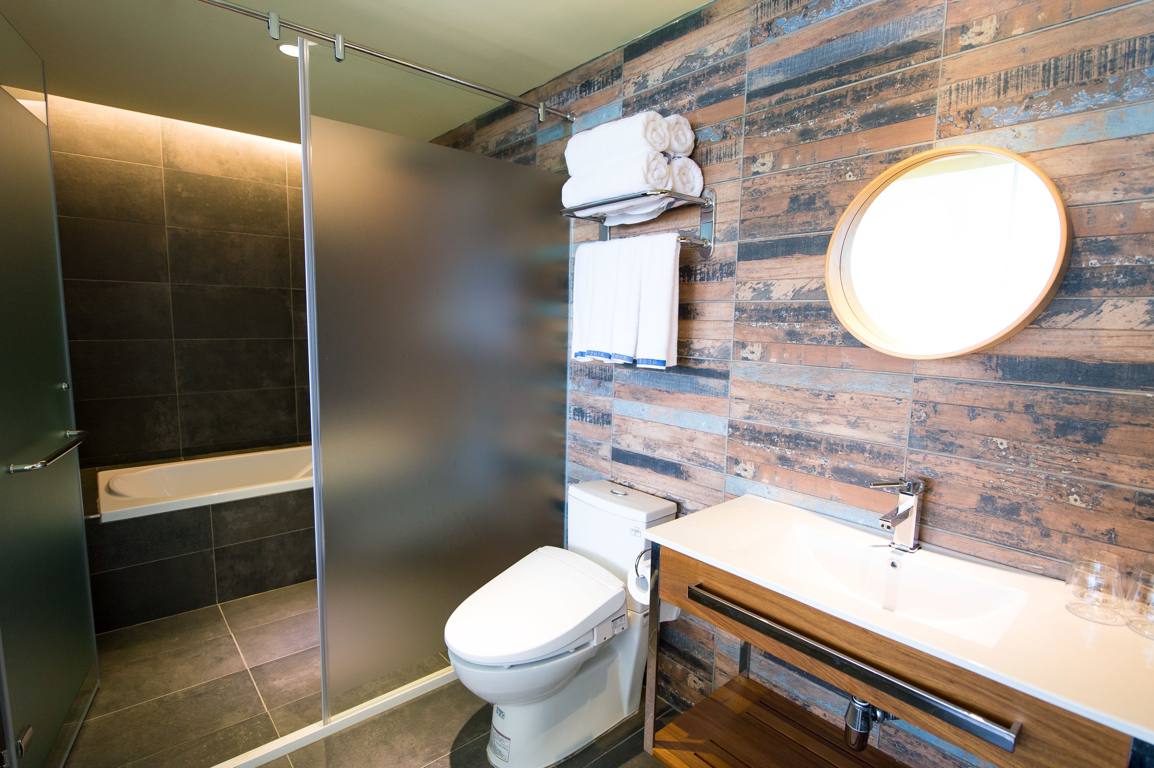 separate bathtub and shower, free toiletries, hair dryer, slippers