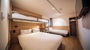 A compact hotel room with a bunk bed, a desk, and a wardrobe. - Premiere Classe Annecy Cran-Gevrier (Annecy)