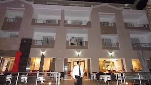 A multi-story hotel with a central courtyard, balconies, and a dining area. - Hotel Marina Prestige Tabarka (Tabarka)