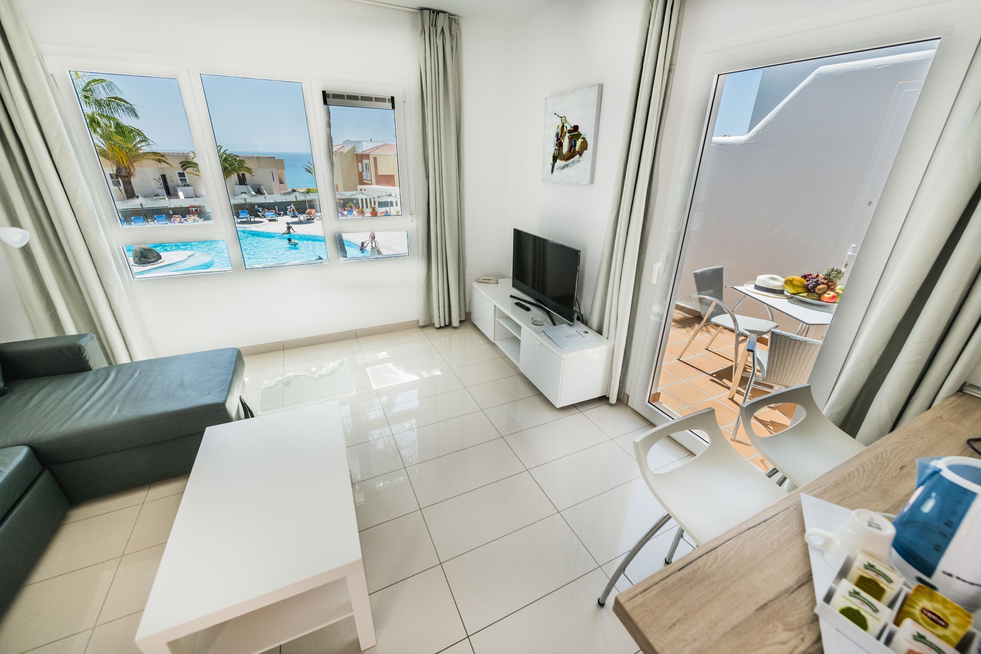 Deluxe Apartment, 1 Bedroom, Sea View | Living area | Flat-screen TV