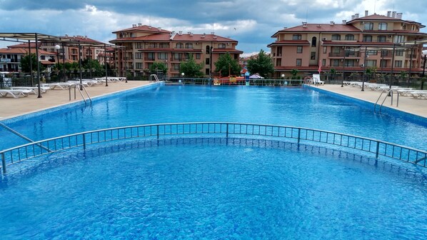 Seasonal outdoor pool, a waterfall pool, sun loungers
