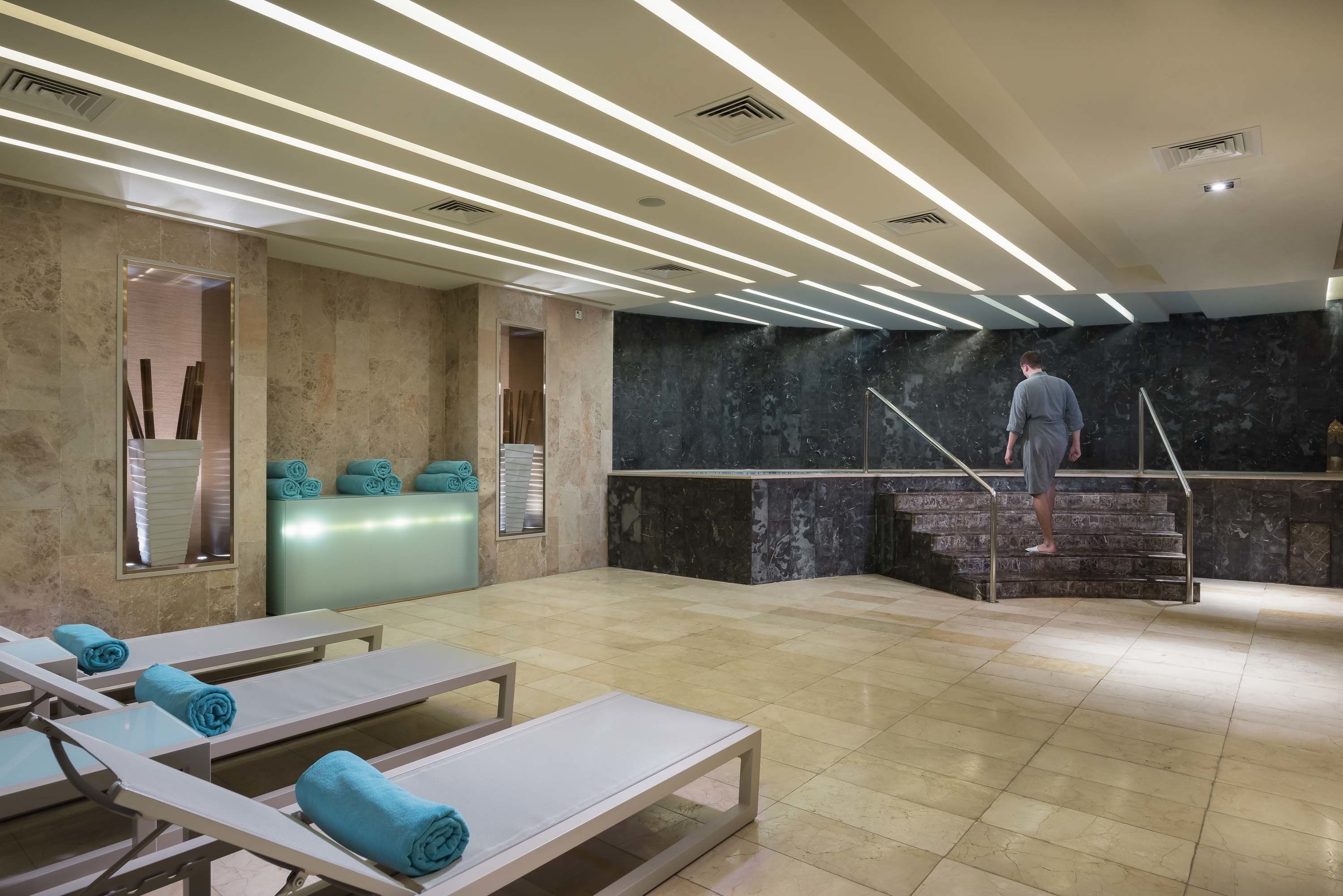 steam room, body treatments, deep-tissue massages, body scrubs, facials