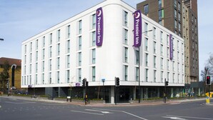 A modern hotel with a curved facade, multiple windows, and prominent Premier Inn signage. - Premier Inn London Sidcup (Sidcup)