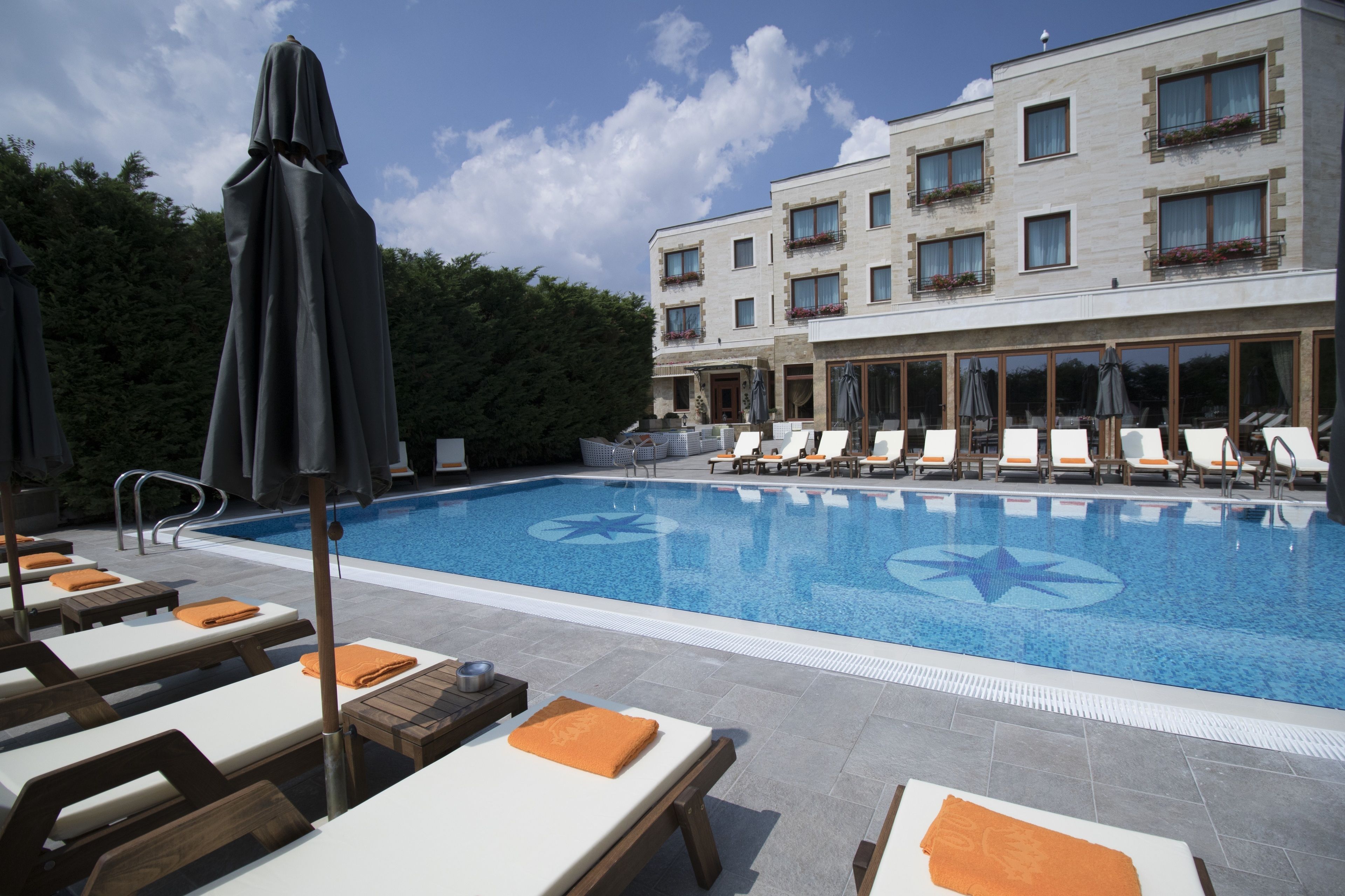 seasonal outdoor pool, pool umbrellas, pool loungers