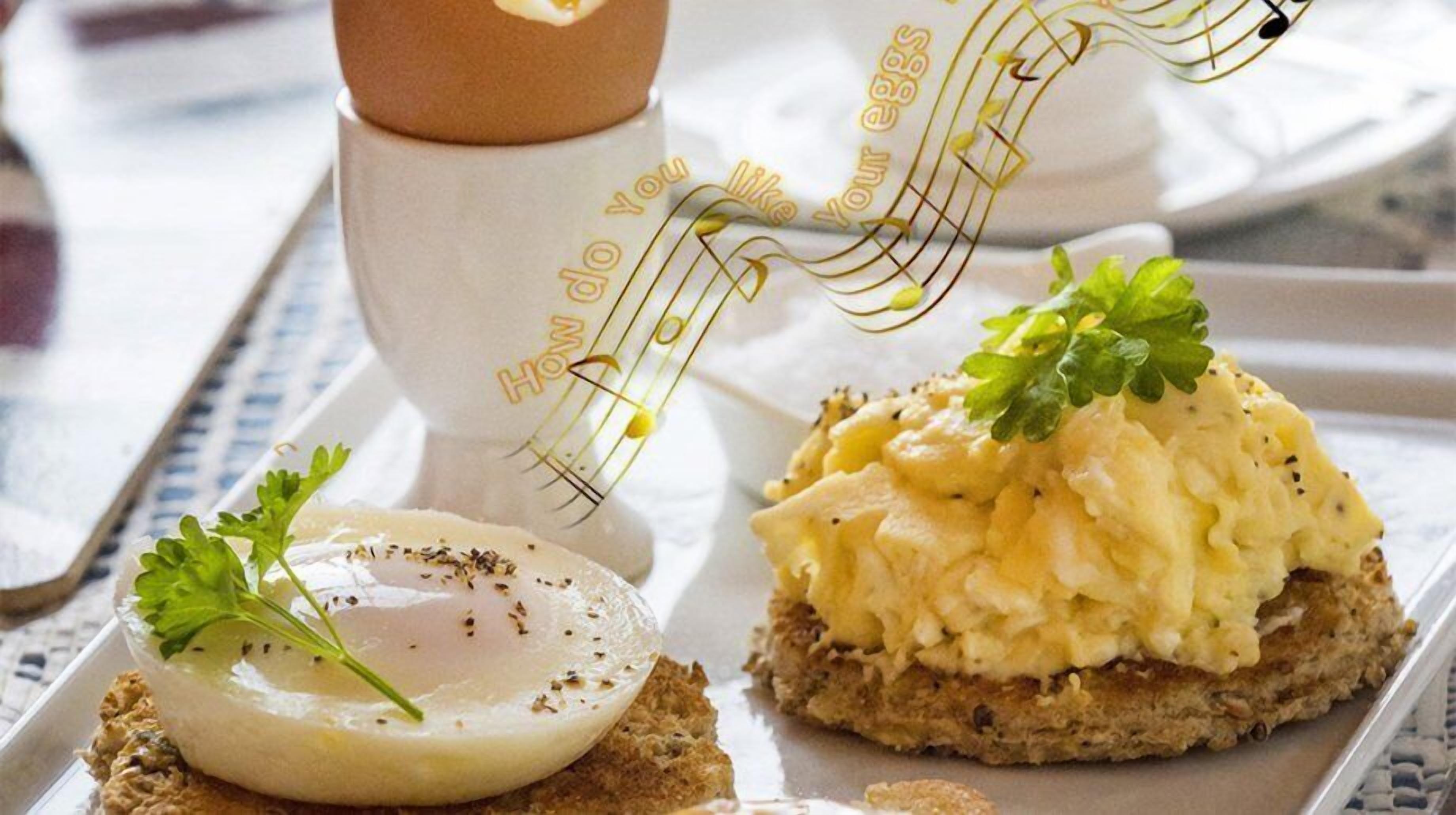A breakfast tray with scrambled eggs, a poached egg, and toast.