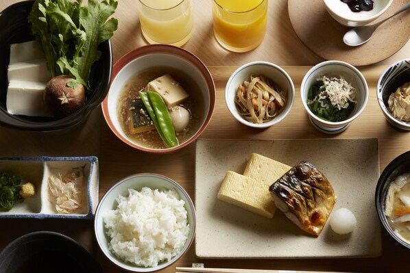 A variety of Japanese dishes including tofu, rice, and pickled vegetables on a wooden table. - ANDO HOTEL NaraWakakusayama~DLIGHT LIFE & HOTELS~ (Nara)