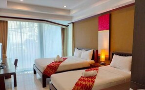 A hotel room with two beds, a desk, and a large window with curtains. - Khon Kaen Orchid Hotel (Khon Kaen)