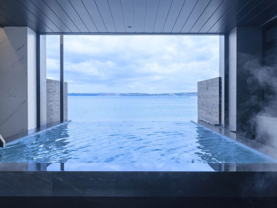 A hot tub with a view of the sea.
