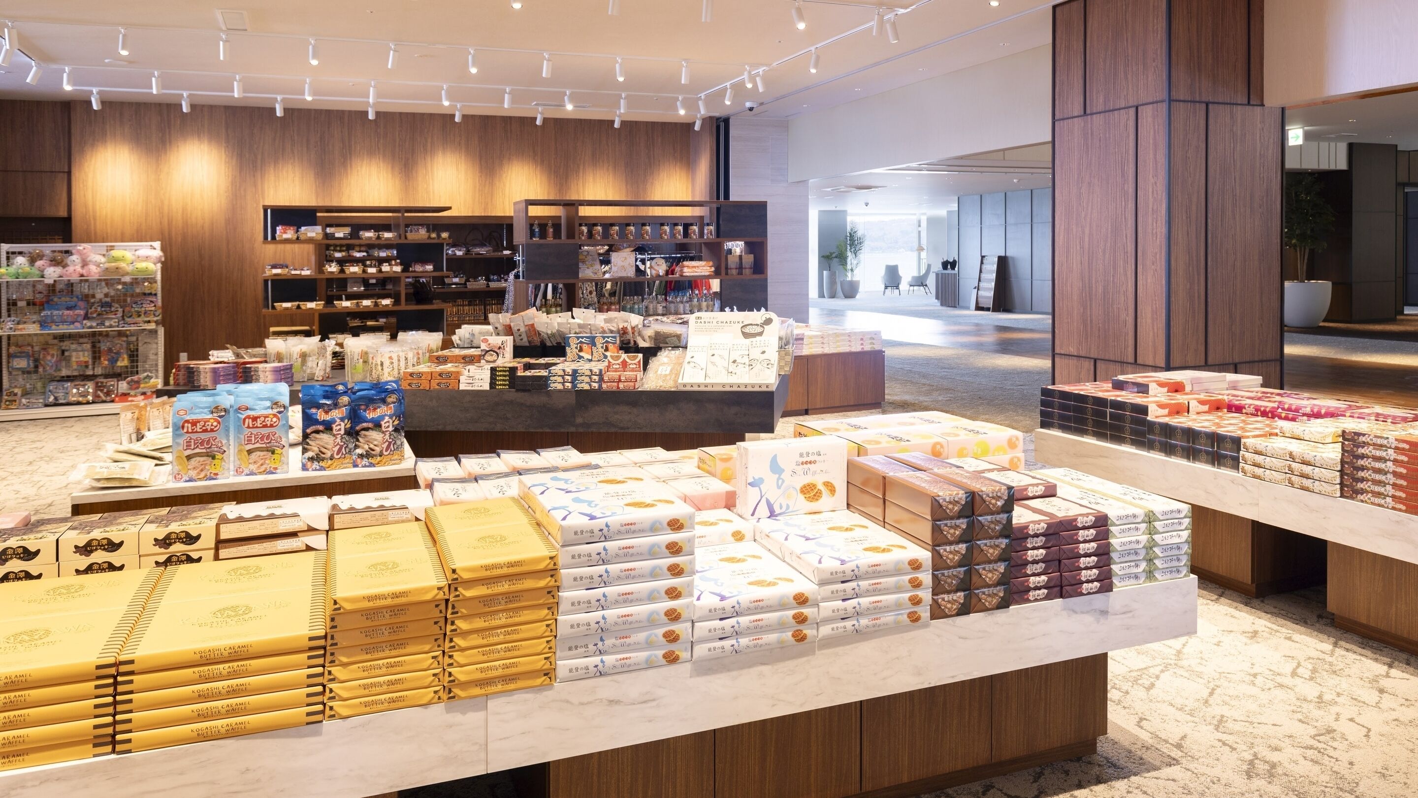 A modern retail space with neatly arranged product displays and wooden accents.