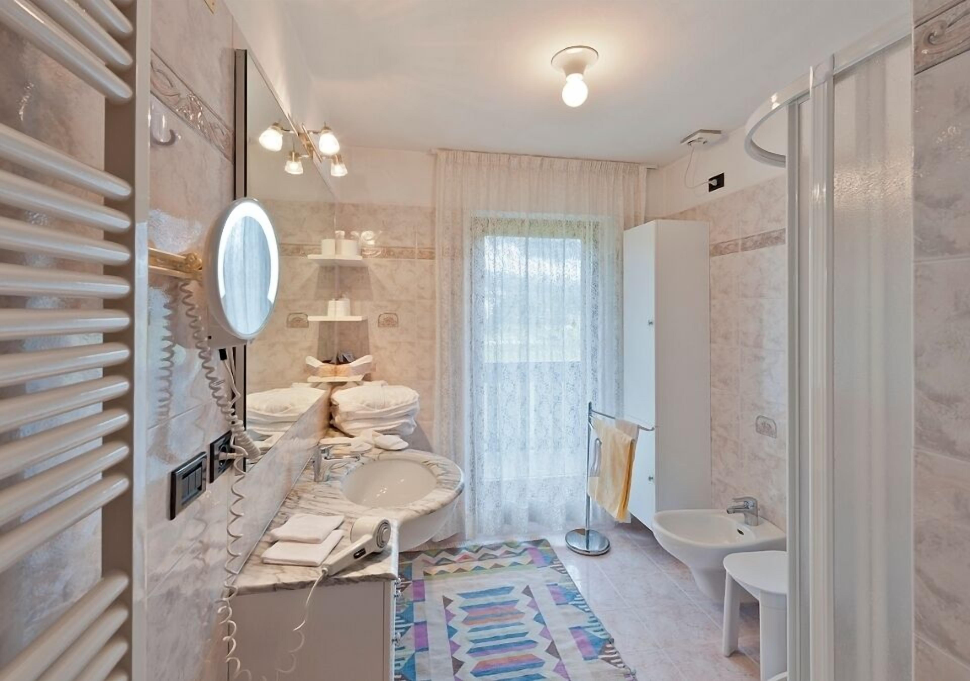 hair dryer, bidet, towels