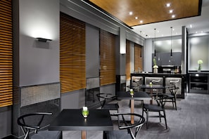 Enjoy dining in style with a modern table setting and comfortable seating.