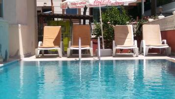 Outdoor pool, pool umbrellas, sun loungers