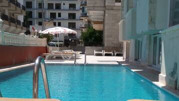 Outdoor pool, pool umbrellas, sun loungers