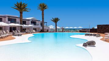 Outdoor pool, open 10:00 AM to 6:00 PM, pool umbrellas, pool loungers