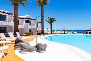 Outdoor pool, open 10:00 AM to 6:00 PM, pool umbrellas, sun loungers