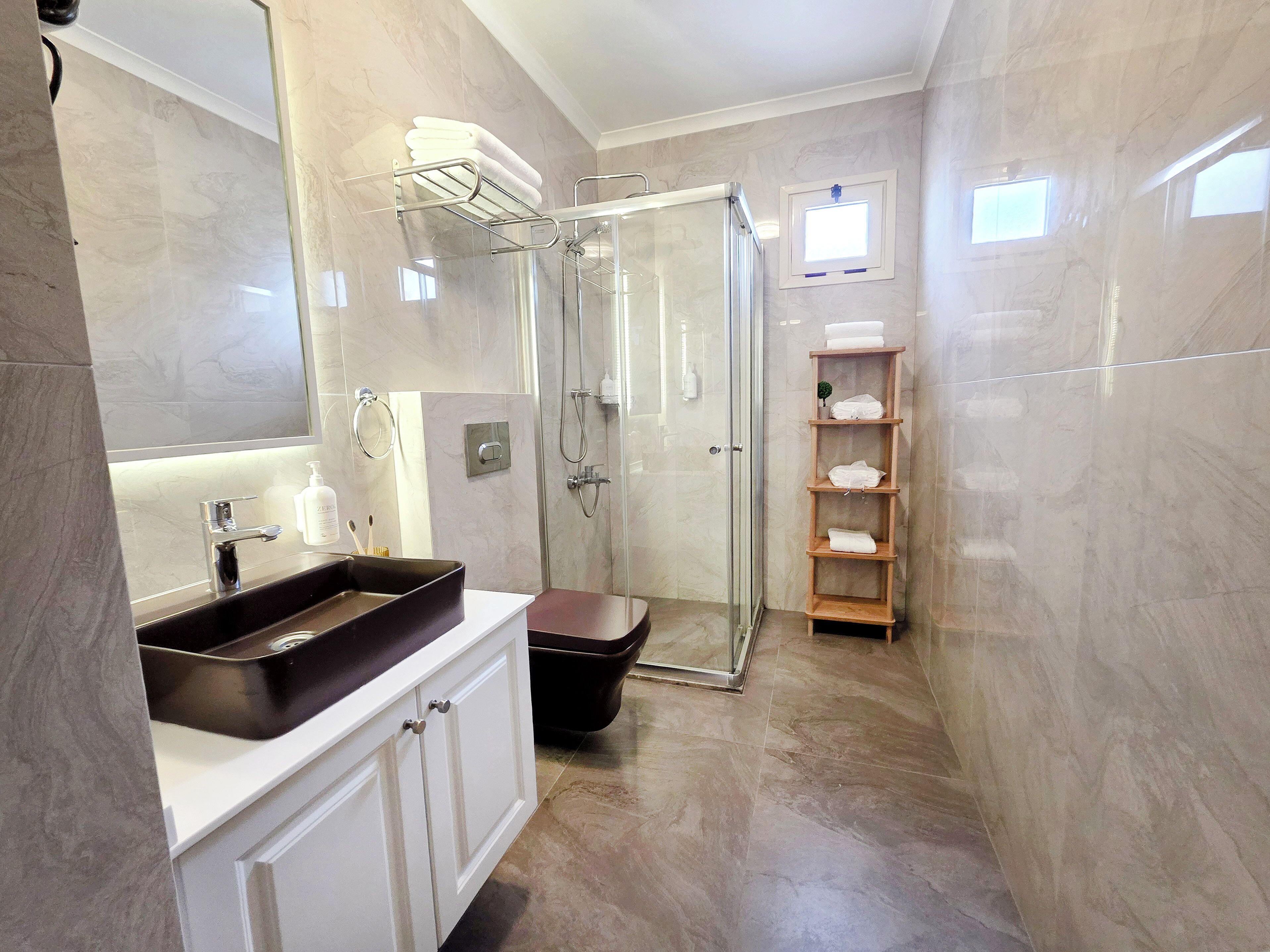 Shower, hydromassage showerhead, designer toiletries, hair dryer