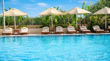 Seasonal outdoor pool, open 8:00 AM to 8:00 PM, free cabanas