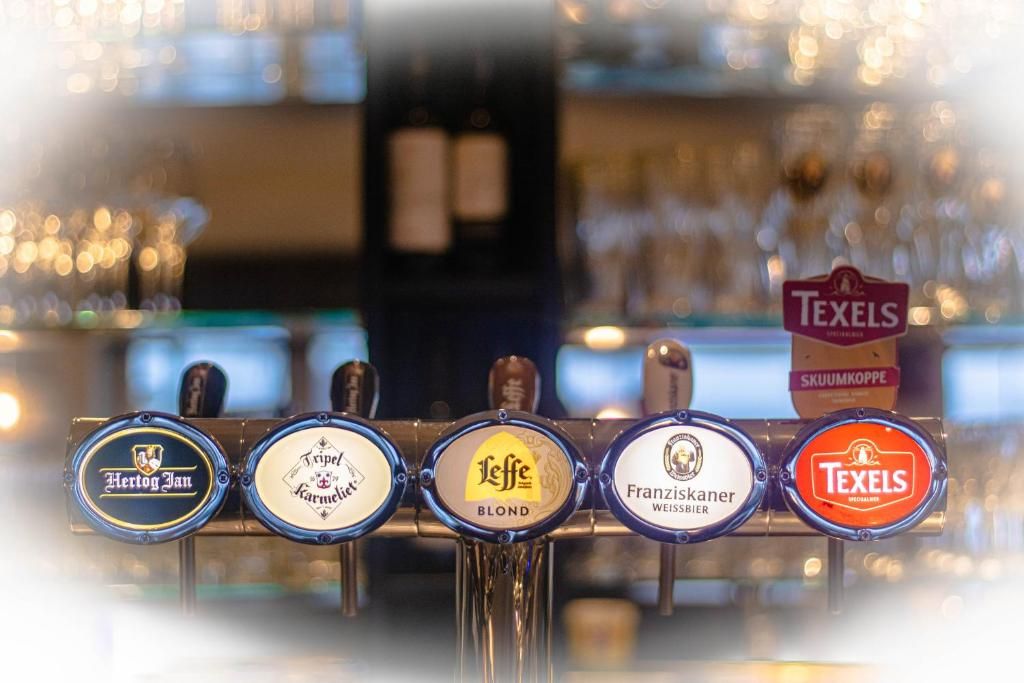 A beer tap with various brands including Hertog Jan, Trippel, Leffe Blond, Franziskaner Weissbier, and Texels.