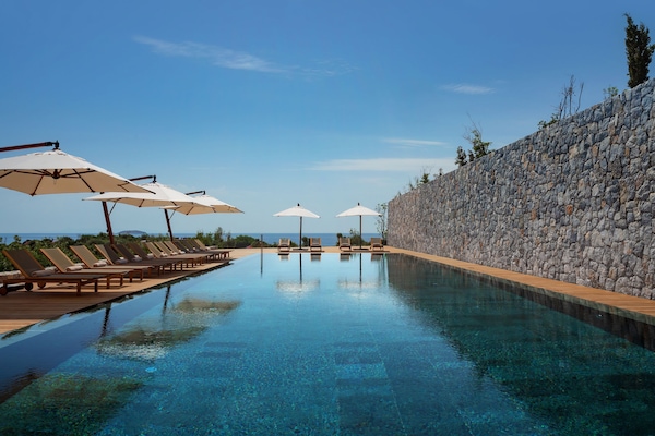 Indoor pool, seasonal outdoor pool, pool umbrellas, sun loungers