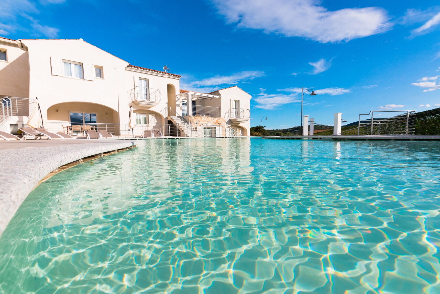 Seasonal outdoor pool, pool umbrellas, pool loungers