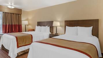 Ropa de cama hipoalergénica, escritorio y tabla de planchar con plancha