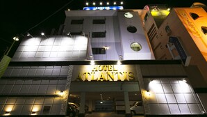 The exterior of the Hotel Atlantis with illuminated signage and a modern architectural design. - Hotel Atlantis Higashiosaka - Adults Only (Higashi-osaka)