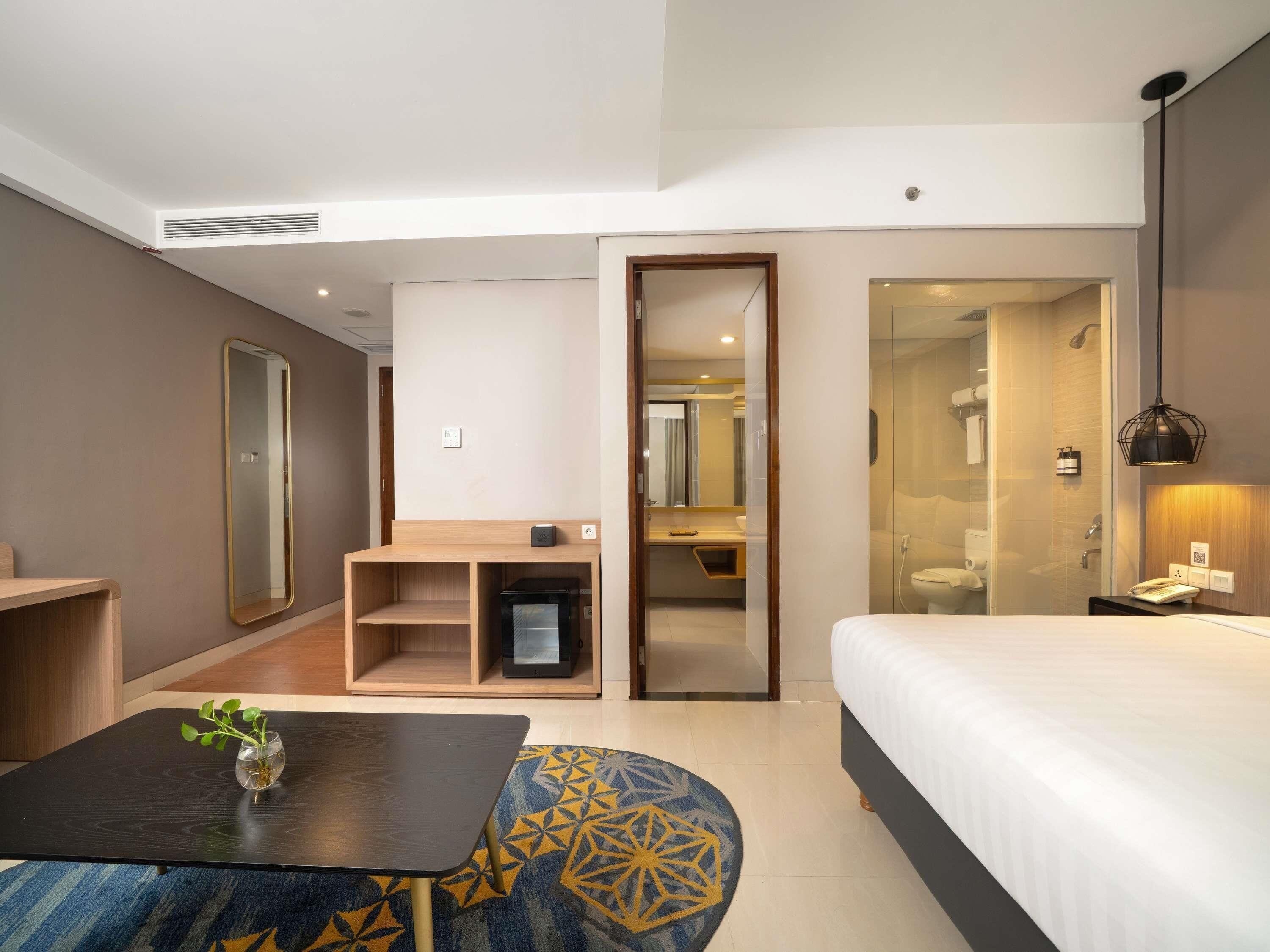 Suite Deluks, 1 Tempat Tidur Double | Brankas, meja kerja, setrika/meja setrika, dan Wi-Fi gratis