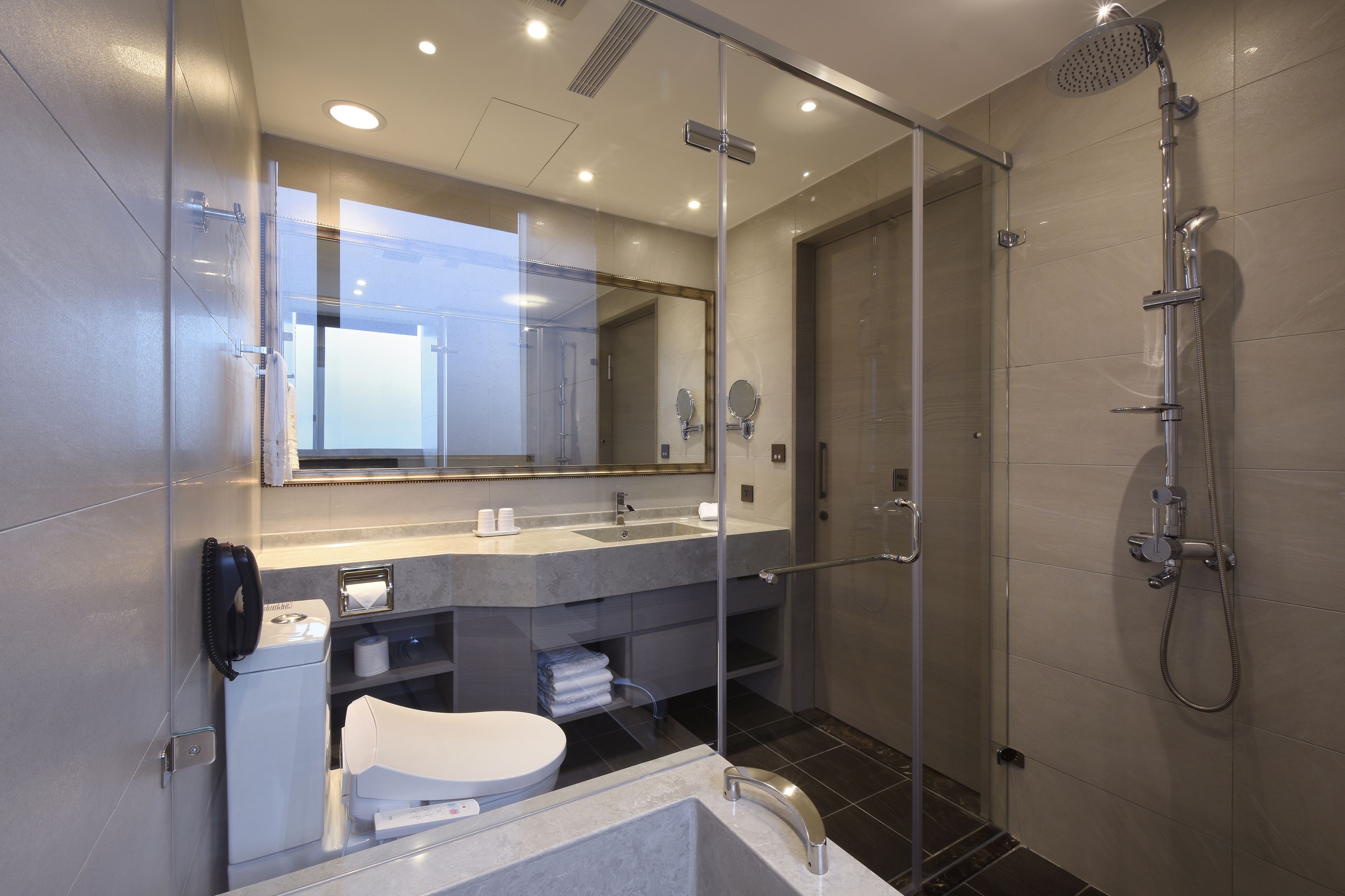 deep-soaking bathtub, rainfall showerhead, hair dryer, towels