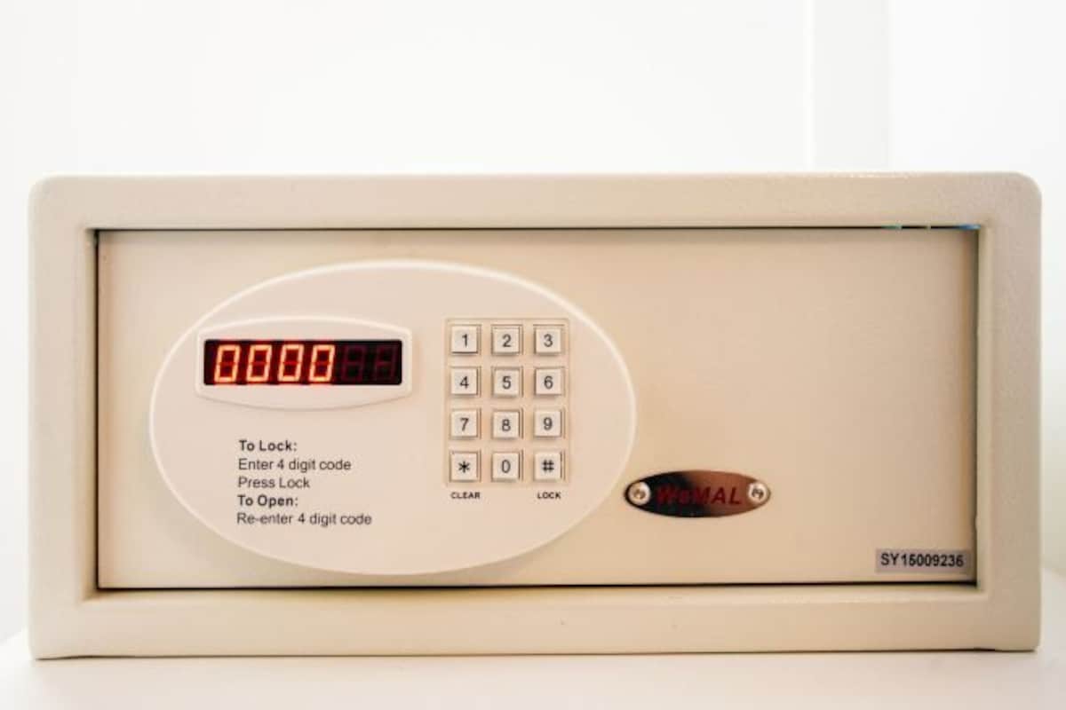A digital lock keypad with a display showing '0000'.