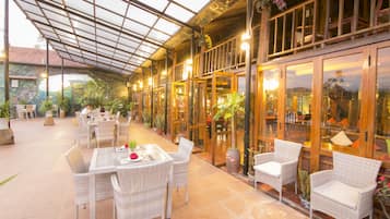 Breakfast, lunch served; international cuisine, al fresco dining