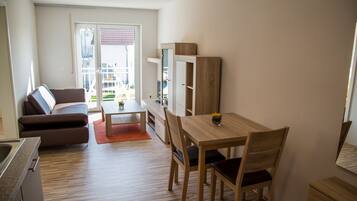 Apartment, 1 Bedroom, Balcony | Living area | Flat-screen TV