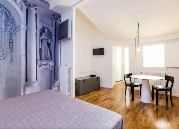 Studio | Egyptian cotton sheets, pillow-top beds, desk, iron/ironing board