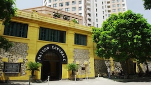 A yellow building with a sign reading "MAISON CENTRALE". - Golden Moon Suite Hotel (Hanoi)