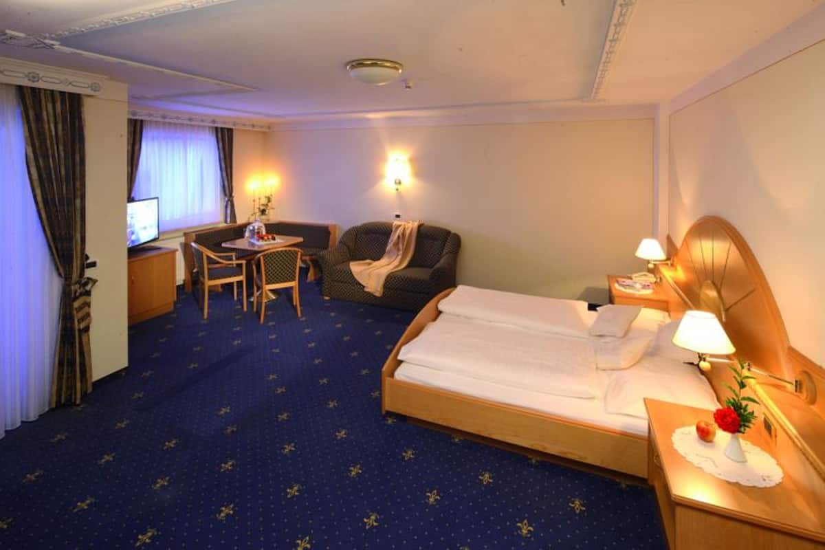 Chambre Junior | Literie de qualité, minibar, coffre-fort, bureau