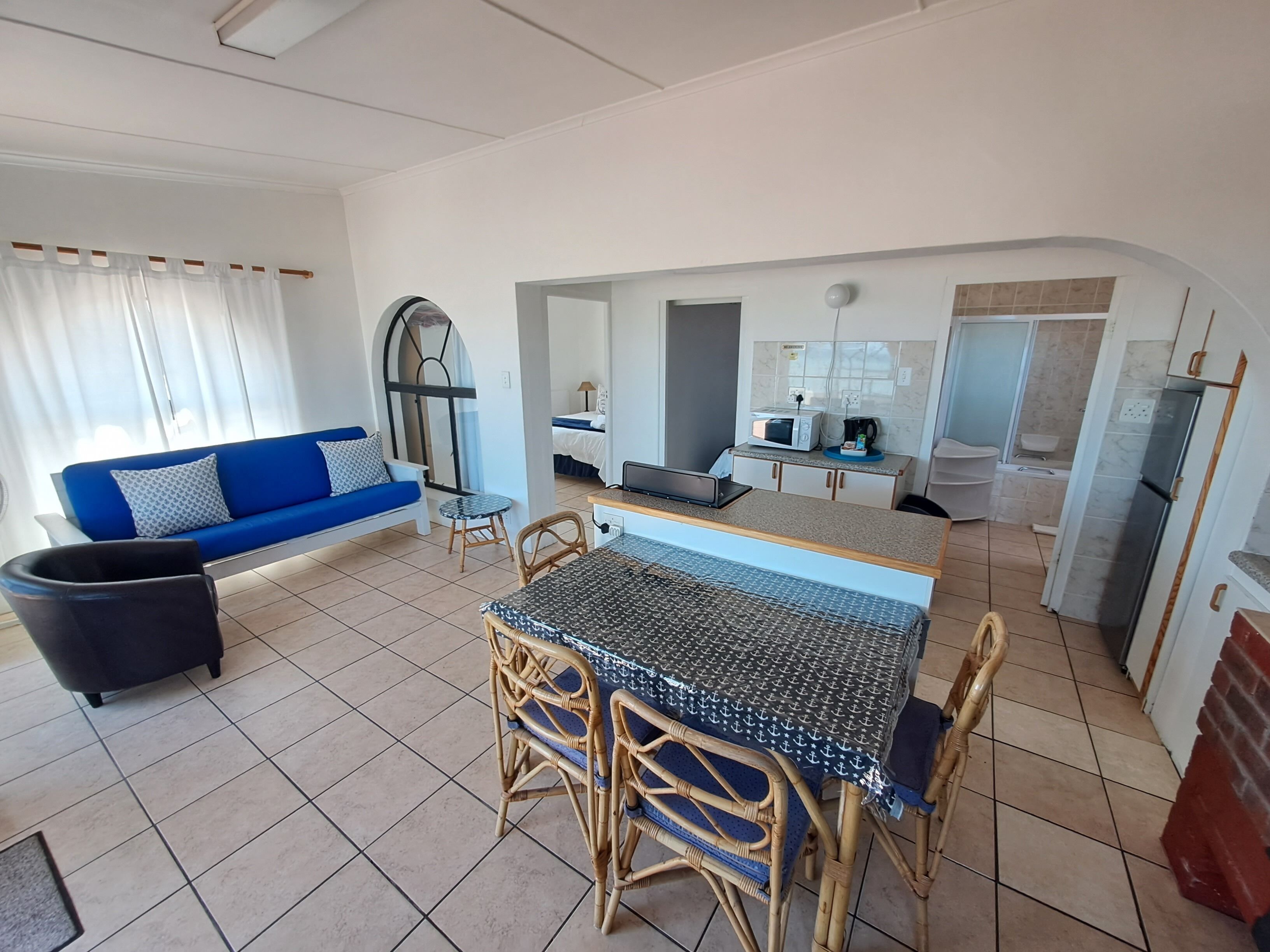Apartamento conforto, 2 quartos, para não fumantes, vista para o oceano | 1 quarto, ferros/tábuas de passar roupa, Wi-Fi de cortesia