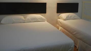 Premium bedding, desk, laptop workspace, iron/ironing board