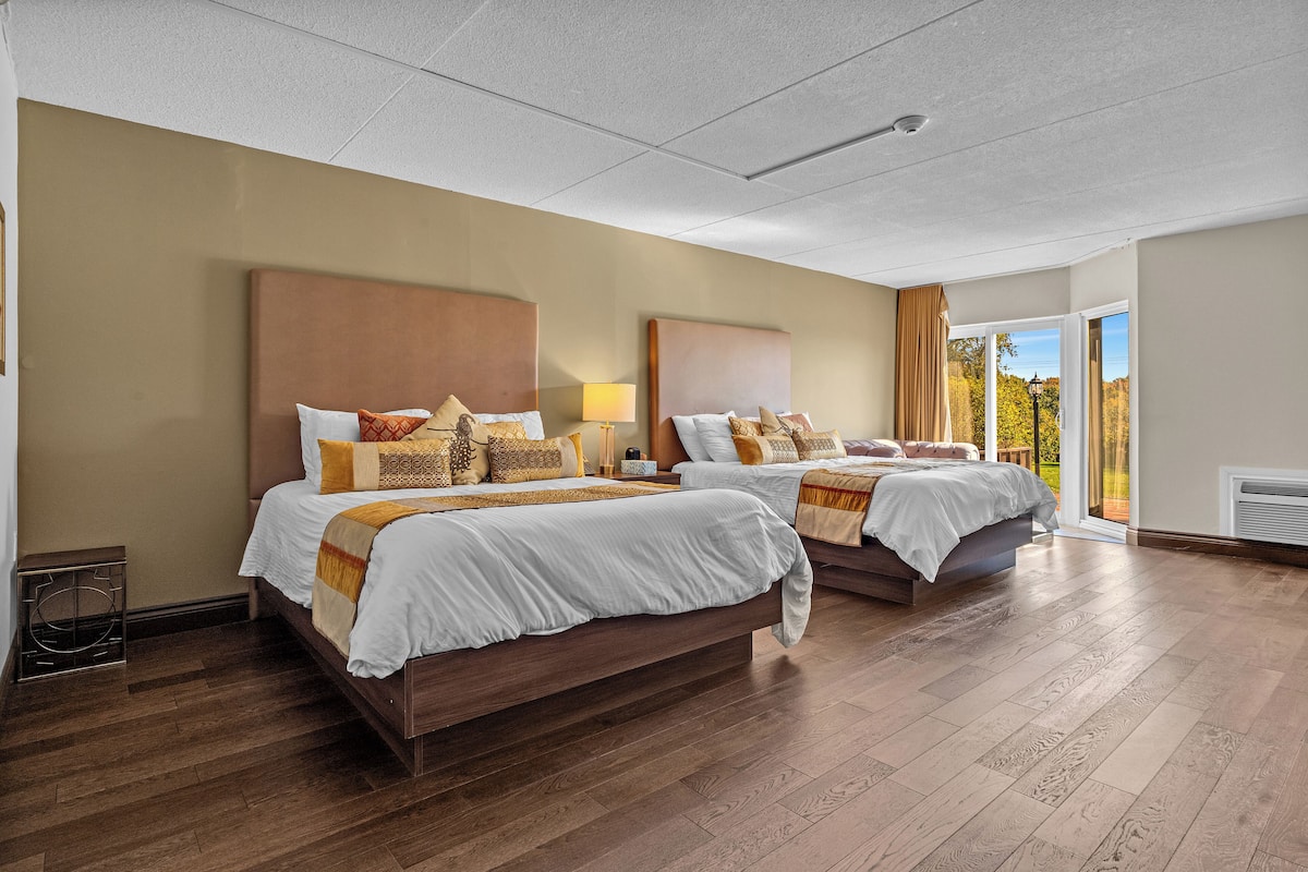 NH Garden Suite | Premium bedding, down duvets, memory-foam beds, desk