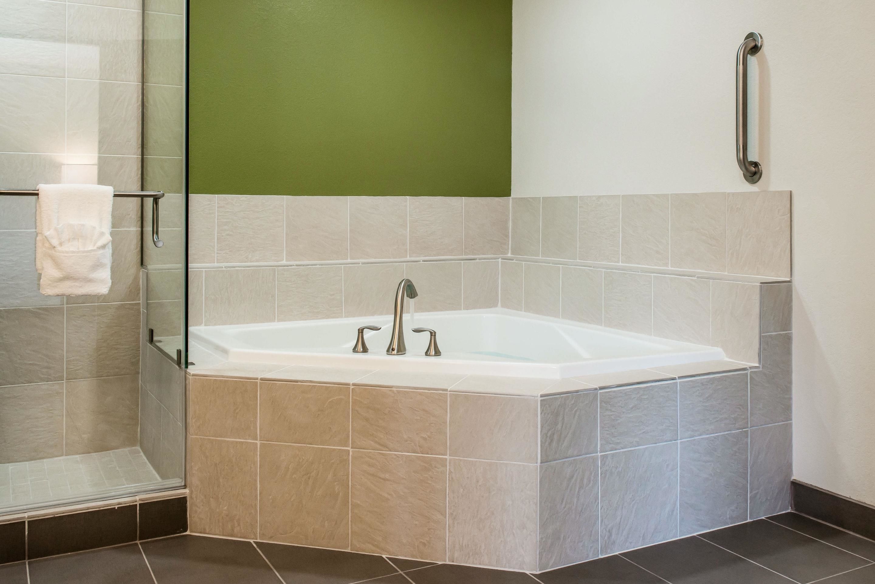 suite, 1 king bed with sofa bed, non smoking (whirlpool) | premium bedding, desk, laptop workspace, blackout curtains