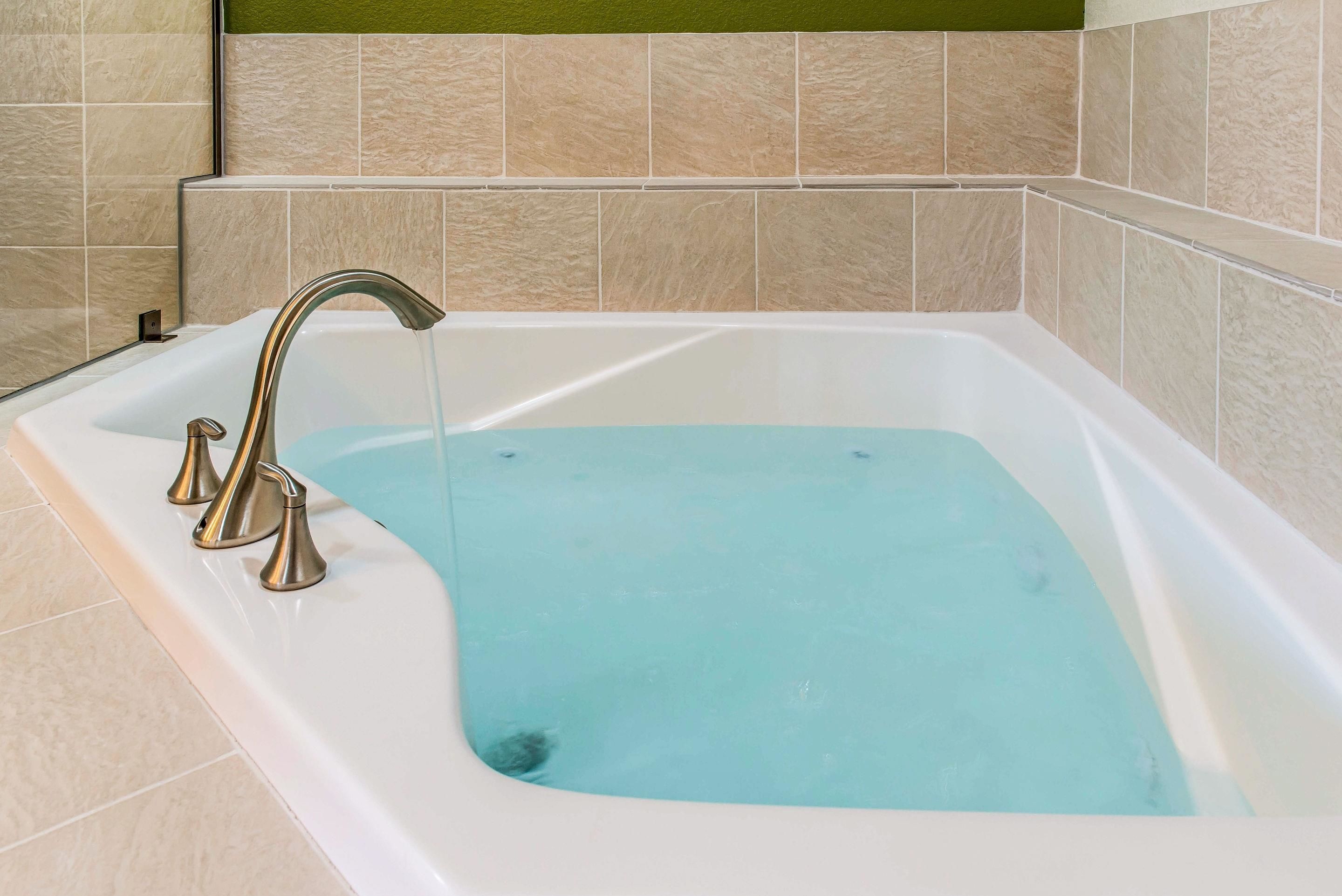 suite, 1 king bed with sofa bed, non smoking (whirlpool) | premium bedding, desk, laptop workspace, blackout curtains