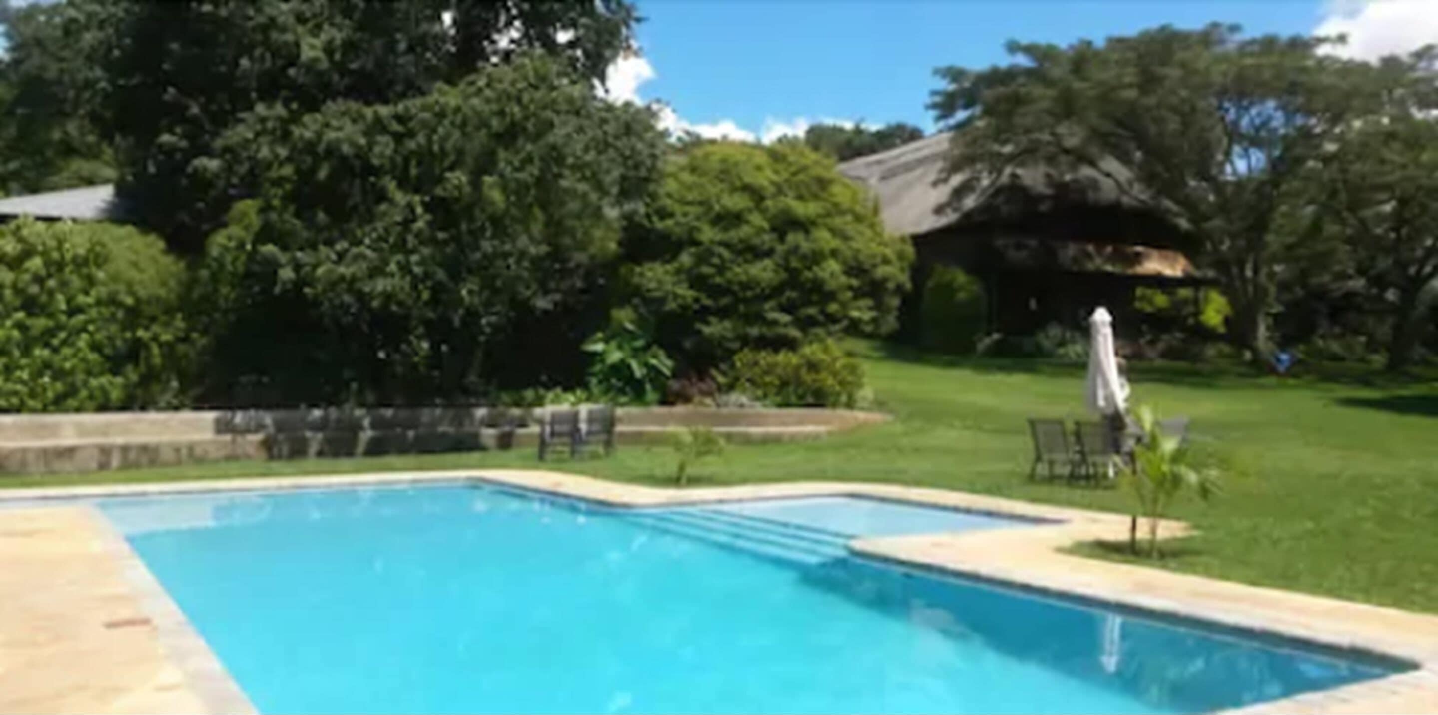 Outdoor pool, open 6 AM to 10 PM, pool umbrellas, sun loungers