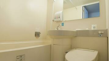 Combined shower/tub, free toiletries, hair dryer, slippers